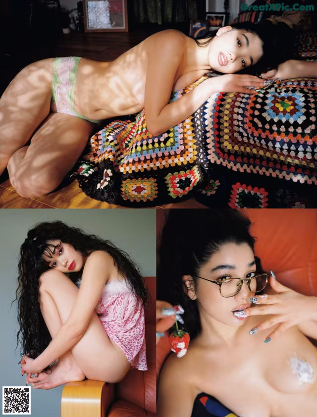A woman laying on top of a bed next to a couch.